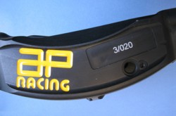 View showing a brake caliper with laser engraved identification number.